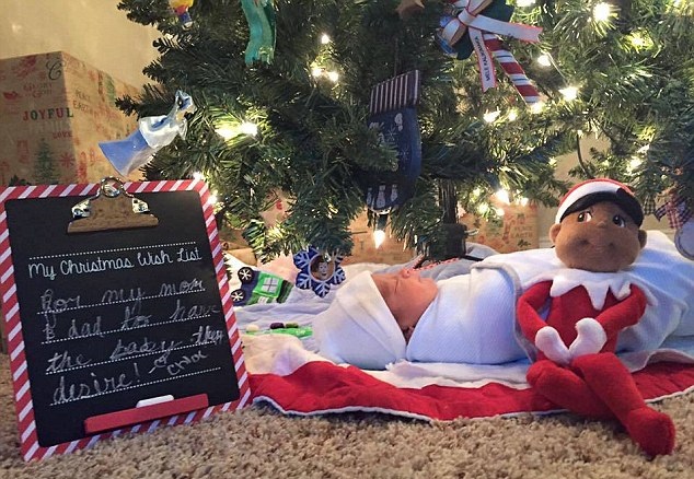 Choe’s Christmas wish for a new baby sits next to her new brother under the Christmas tree.